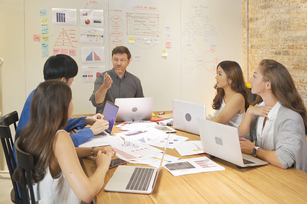 A group of multi ethnic business team talk, communicate, discuss, a Photo by Tampatra