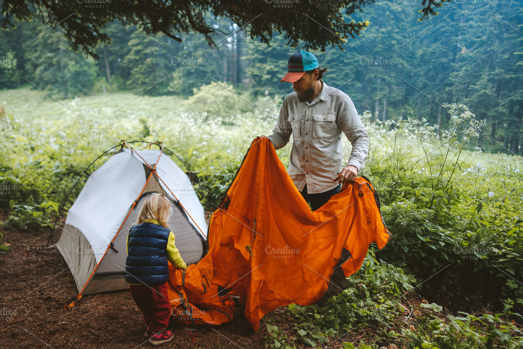 Father and daughter are setting up camping tent family vacations travel lifesty, a Person Photo by e v e r s t