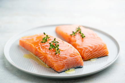 Fresh salmon fillet on a plate for delicious salmon steak.