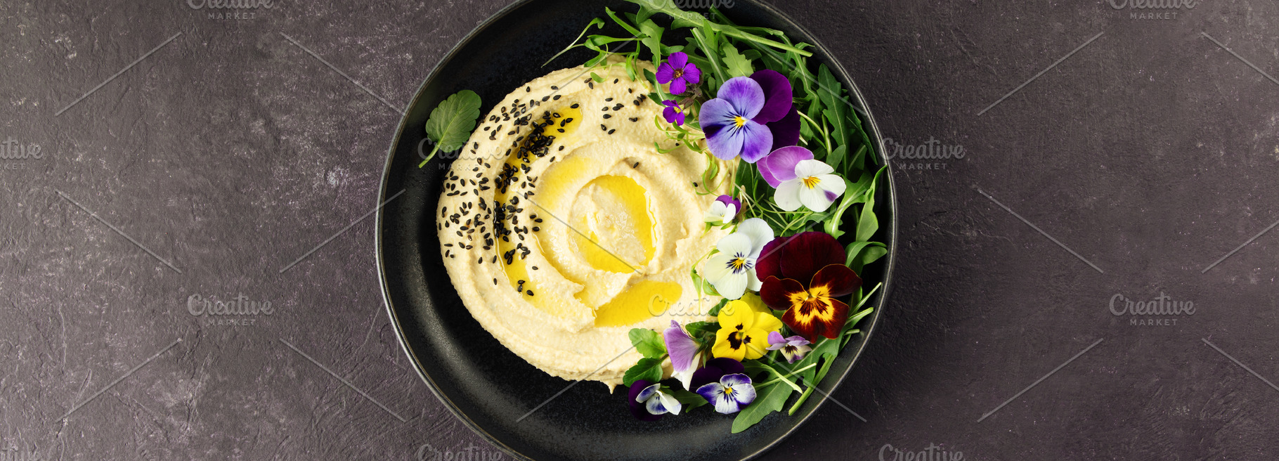 Gourmet Hummus with Edible Flowers and Olive Oil on Dark Backgro, a Food & Drink Photo by Natalia Klenova's Shop
