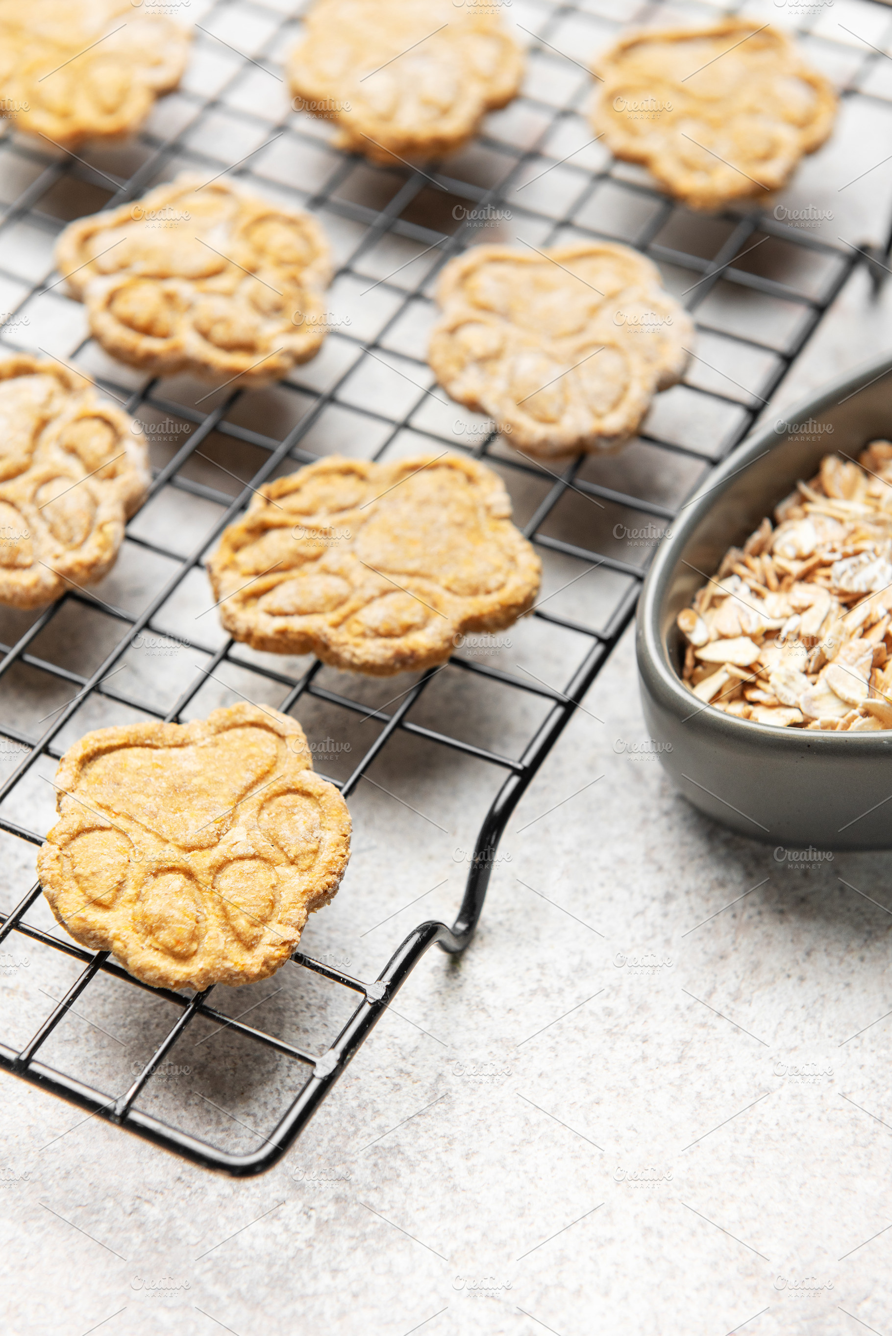 Homemade dog treats baking on cooling rack with oats, a Food & Drink Photo by Olena Rudo
