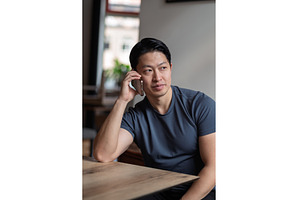 Confident man having phone call at, a Person Photo by HalfPoint