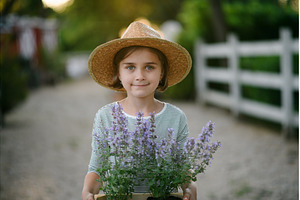 Beautiful young girl helping on, a Nature Photo by HalfPoint