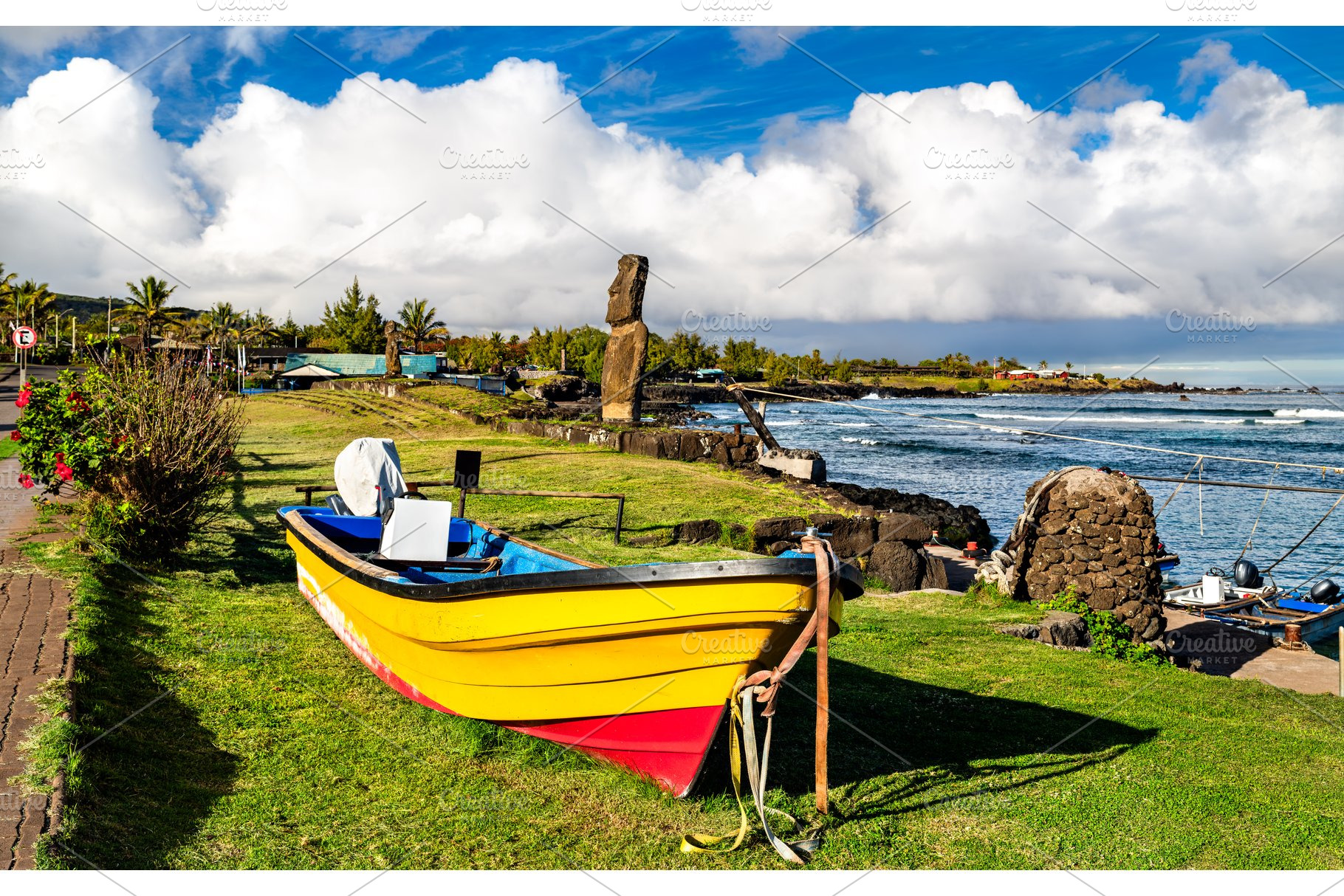 Colorful boat on the grass at Caleta Hanga Roa in Easter Island, a Transportation Photo by Leonid Andronov