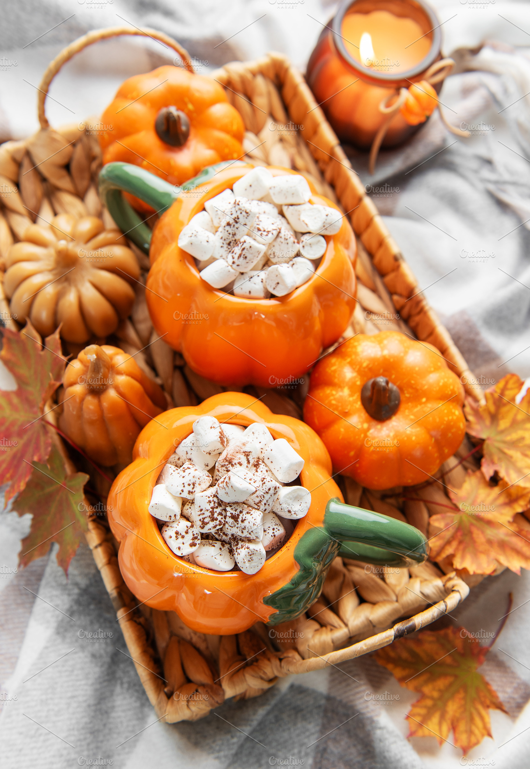 Warming pumpkin mugs filled with hot chocolate and marshmallows, a Food & Drink Photo by Olena Rudo