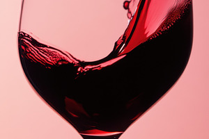 Red wine splashing in a glass, a Photo by Beautiful things