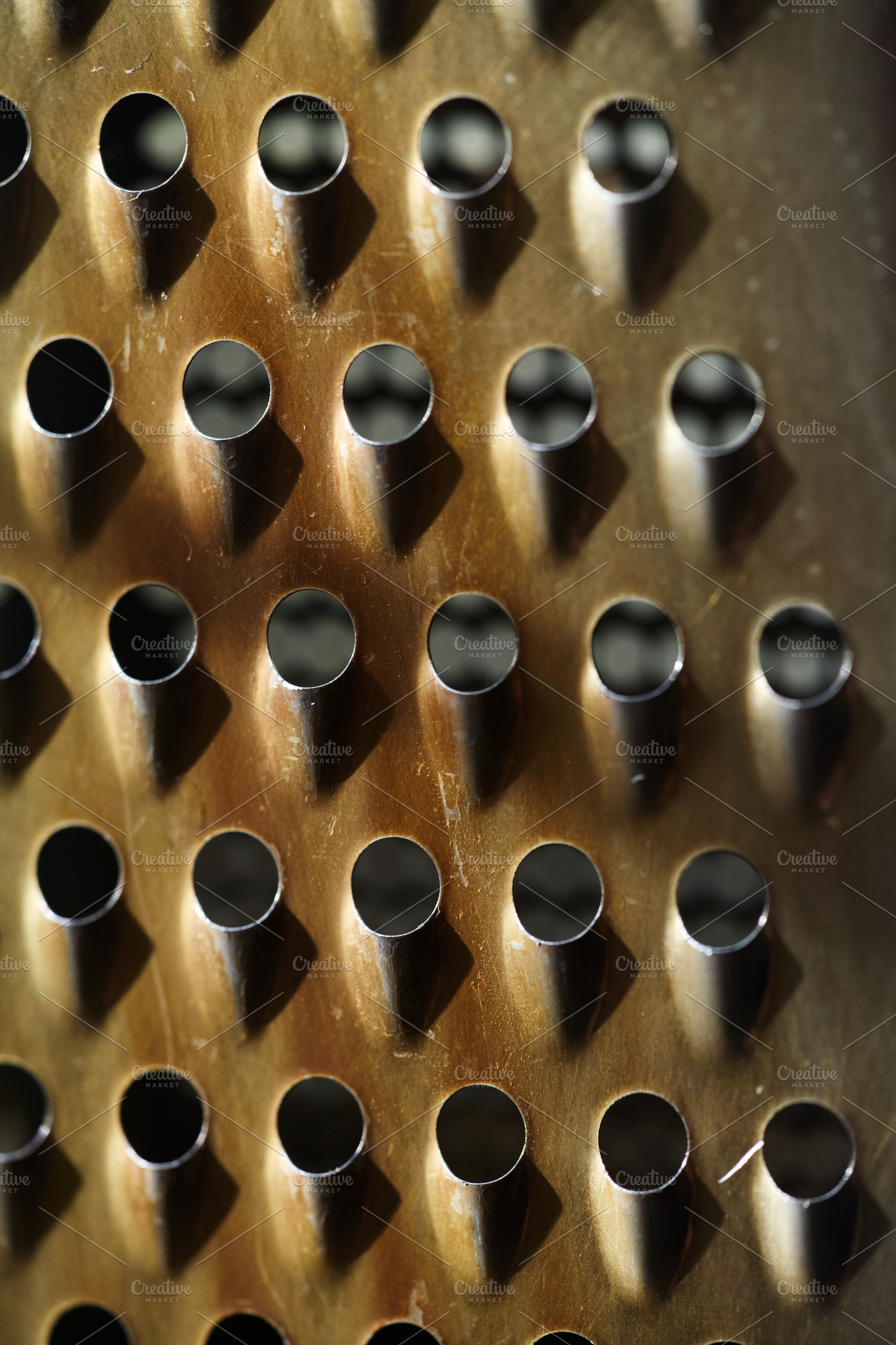 Macro abstract of weathered metal surface with high-contrast shadows. Rhythmic, a Background Photo by Rohan Photography