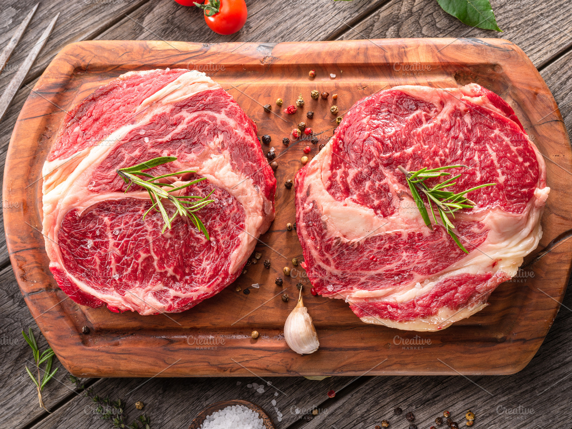 Raw beef steaks with herbs and spice, a Food & Drink Photo by Volff