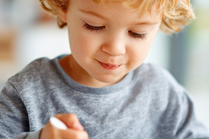 Child enjoying breakfast cereal, a Person Photo by AlyaAnd