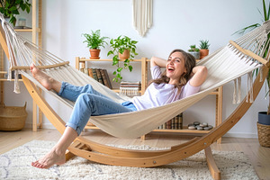Young Woman Relaxing in Indoor Hammock, a Photo by Davizro's Market