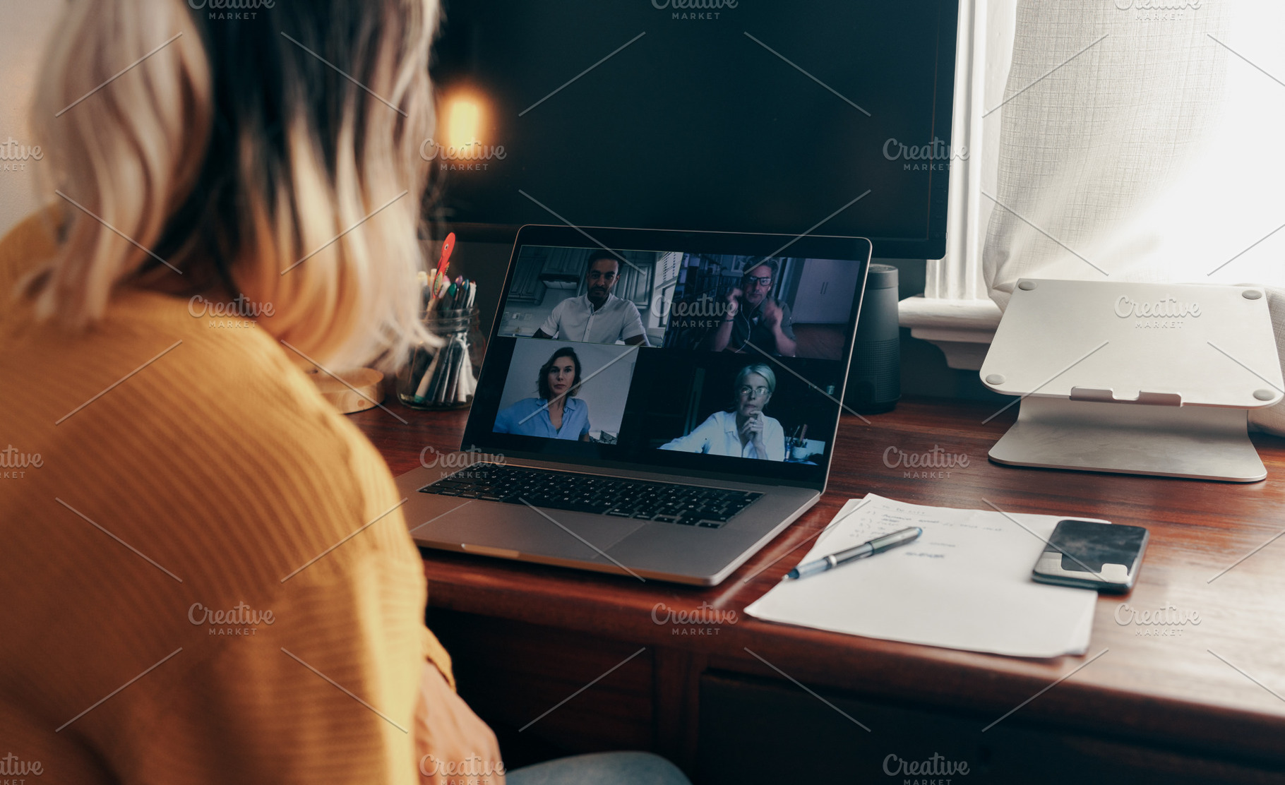 Businesswoman attending a virtual meeting while working from hom, a Person Photo by Jacob Lund