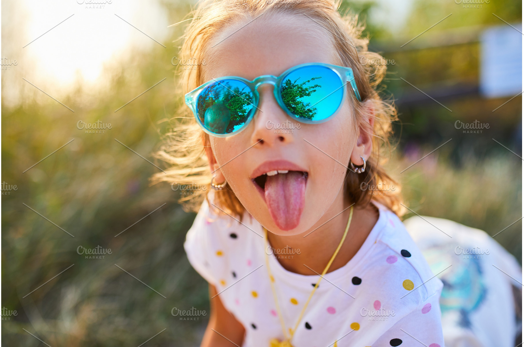 Young girl enjoys sunny day outdoors, a Nature Photo by IlliaBondarPhotography