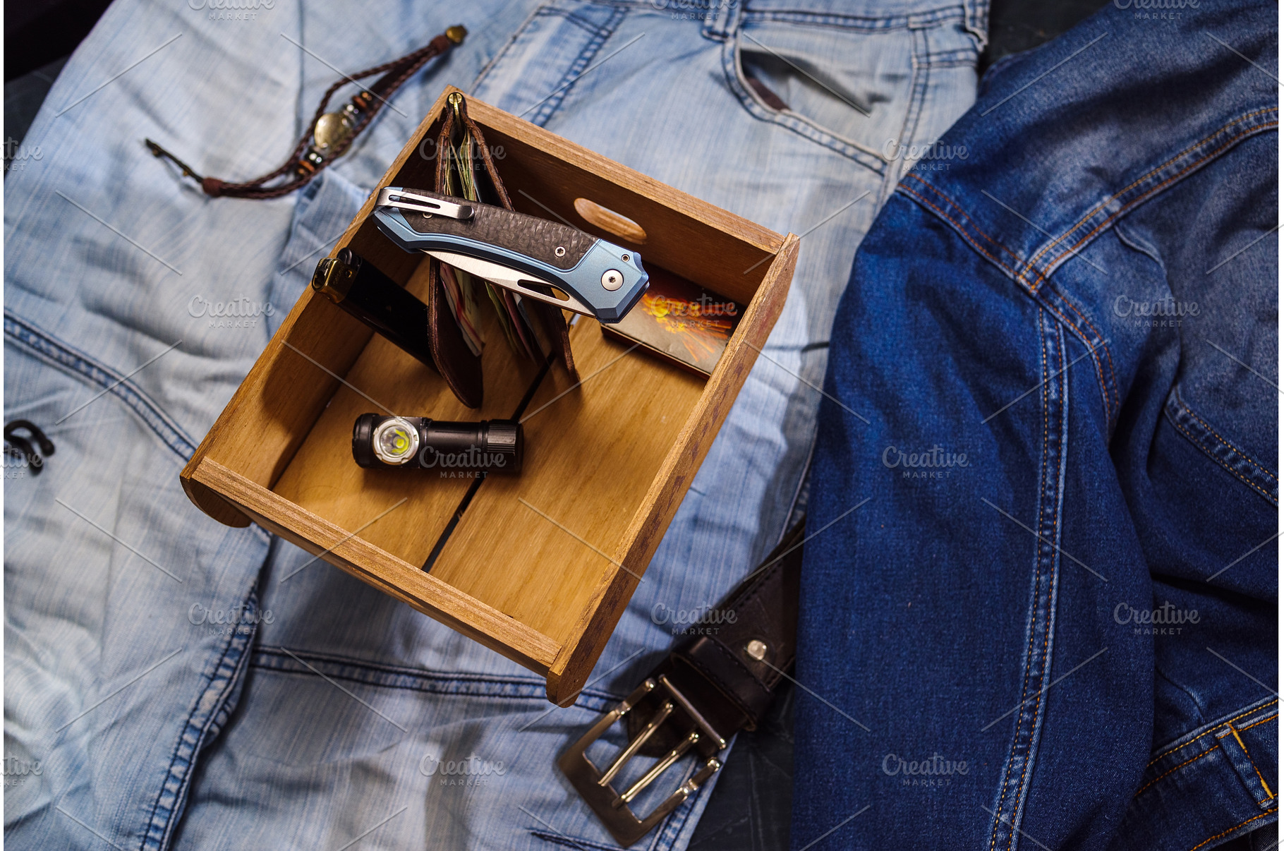 Folding knife, flashlight and money, an Industrial Photo by Stockphoto by vzwer
