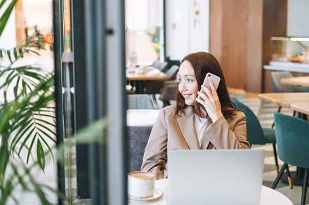 Adult woman using laptop in cafe, a Business Photo by Galina_Zhigalova