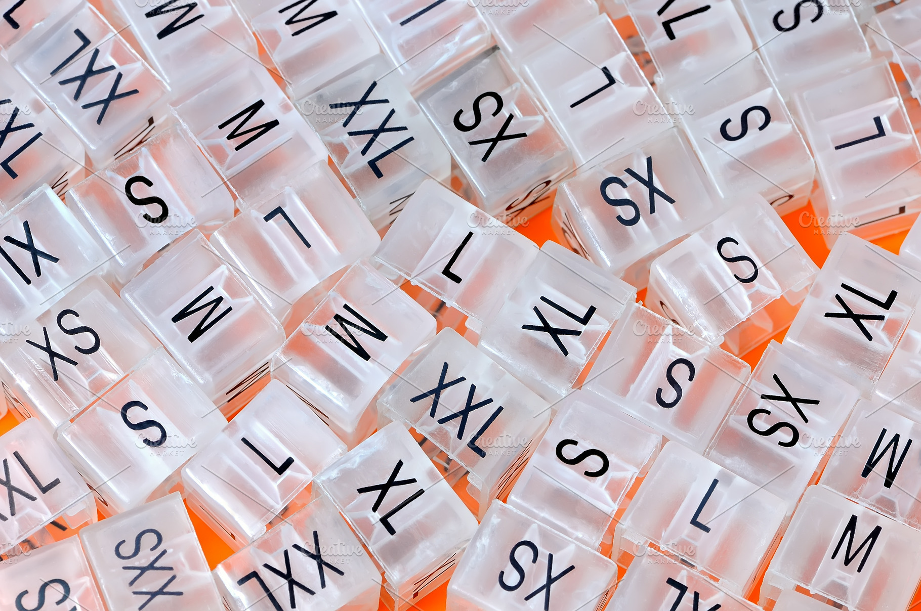 Various plastic clothing size tags featuring size, xxs, and xs, a Beauty & Fashion Photo by FedotovAnatoly