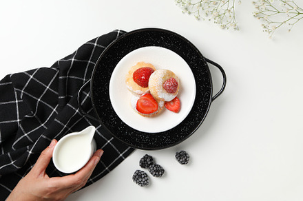 Concept of tasty sweet food, cheese pancakes, top view, a Food & Drink Photo by AtlasStudio PRO