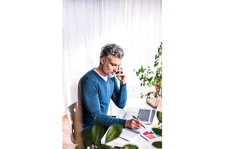 Man phone calling and writing notes, a Business Photo by HalfPoint