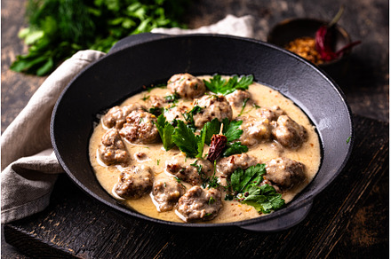 Meatballs in sour cream sauce in a
