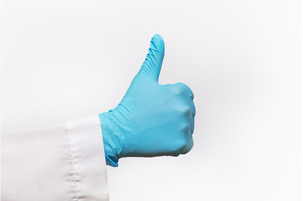 Partial view of hand wearing blue, a Health & Medical Photo by Aliona Serzhanova