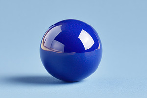 Cobalt sphere displayed on soft blue surface in clean, minimalistic design, a Photo by AlyaAnd