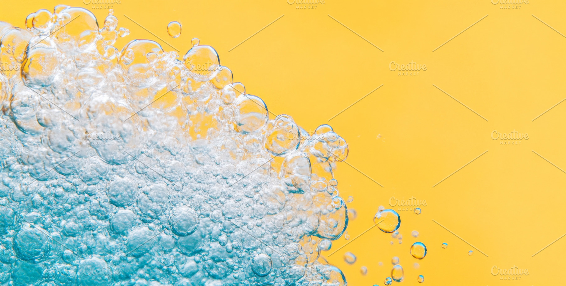 Close-up of blue detergent foam on yellow background, ideal for, a Photo by Dvoevnore photos