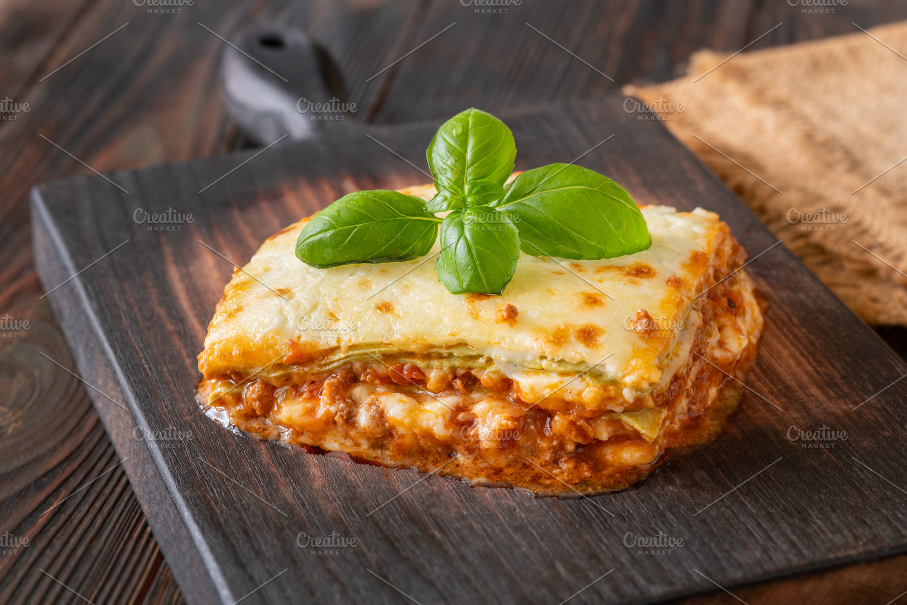 Traditional Lasagna Bolognese Slice Served On Dark Rustic Wooden, a Food & Drink Photo by Alexander Prokopenko