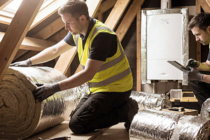 Worker prepare reflective insulation, an Industrial Photo by Shootdiem