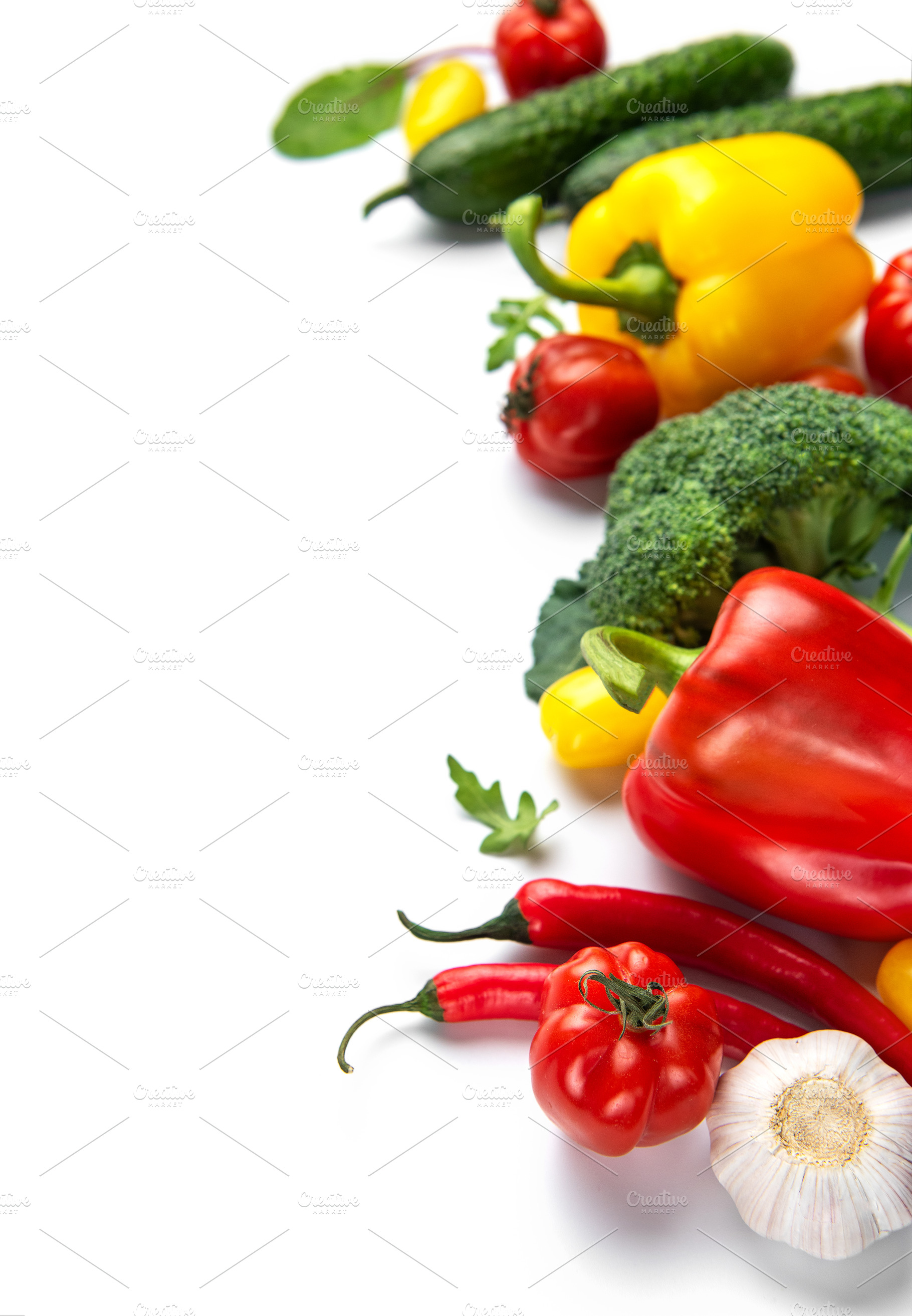 Fresh organic vegetables creating healthy eating concept on whit, a Food & Drink Photo by Olena Rudo