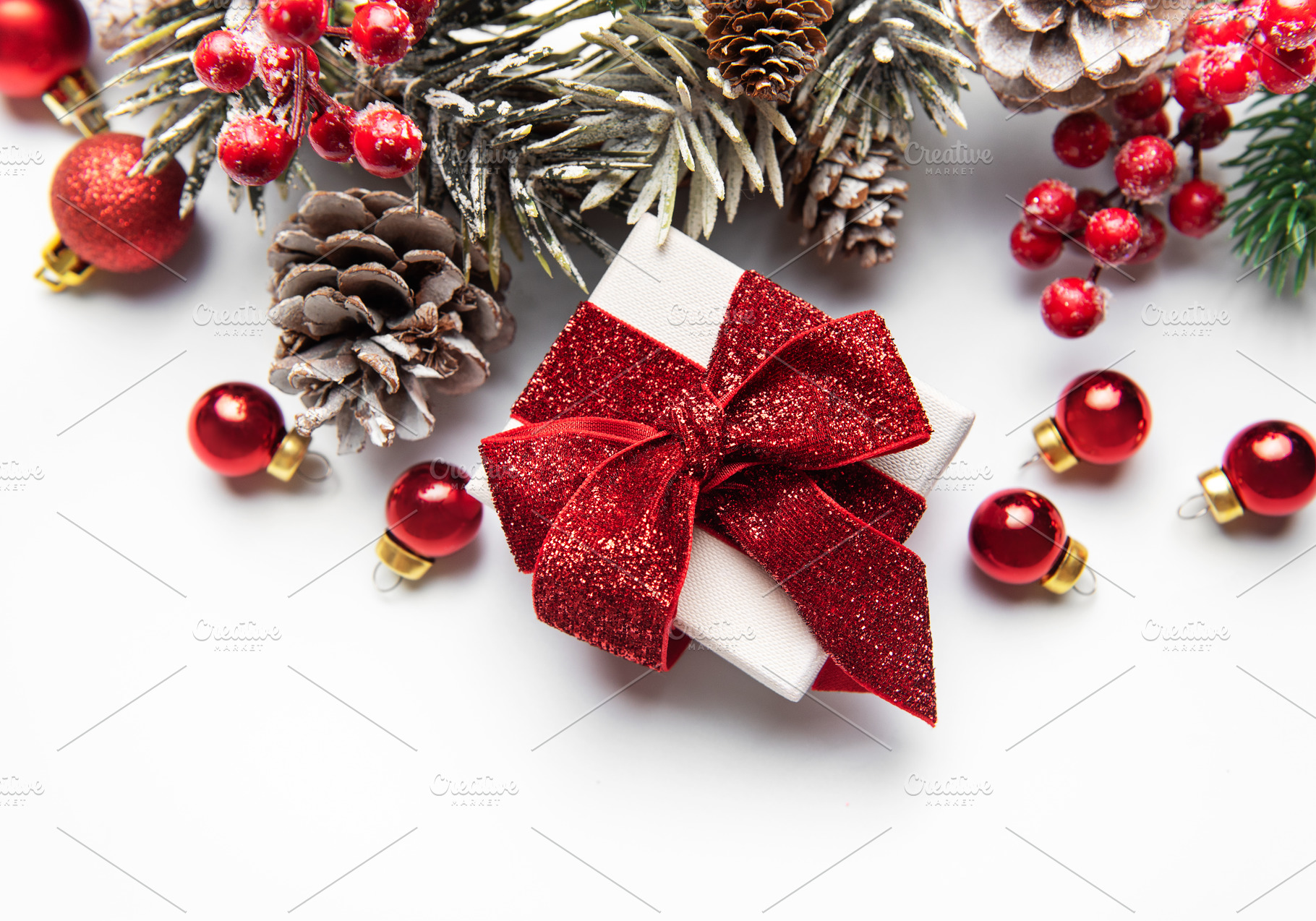 Christmas giftbox with red ribbon and winter holiday decorations, a Holiday Photo by Olena Rudo