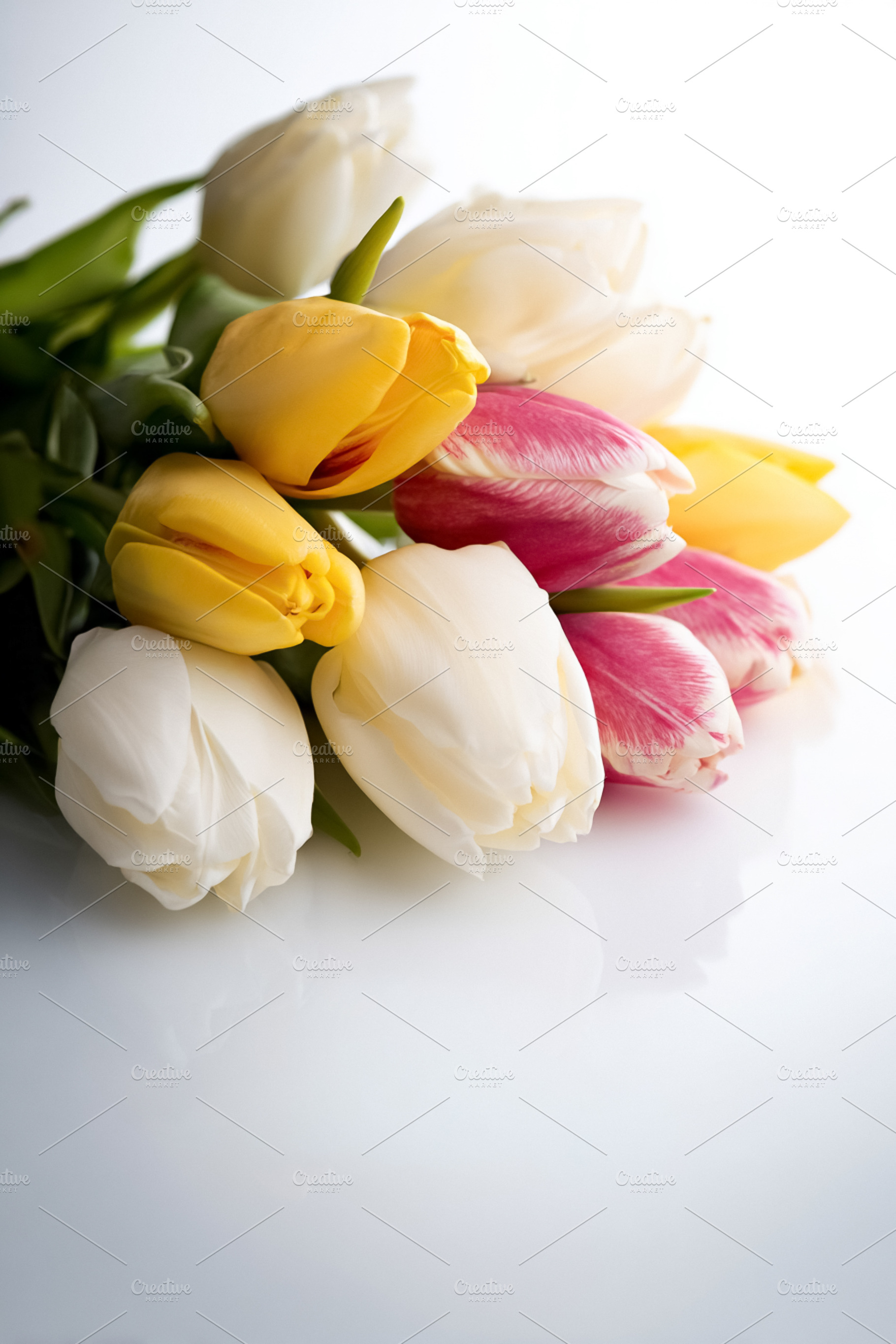 Colorful tulips bouquet creating a vibrant spring display with a, a Photo by Studio ANNA
