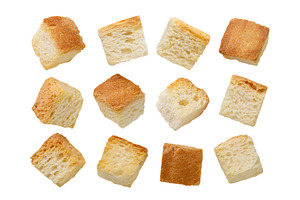 Set of croutons close-up on a white, a Food & Drink Photo by innakreativ