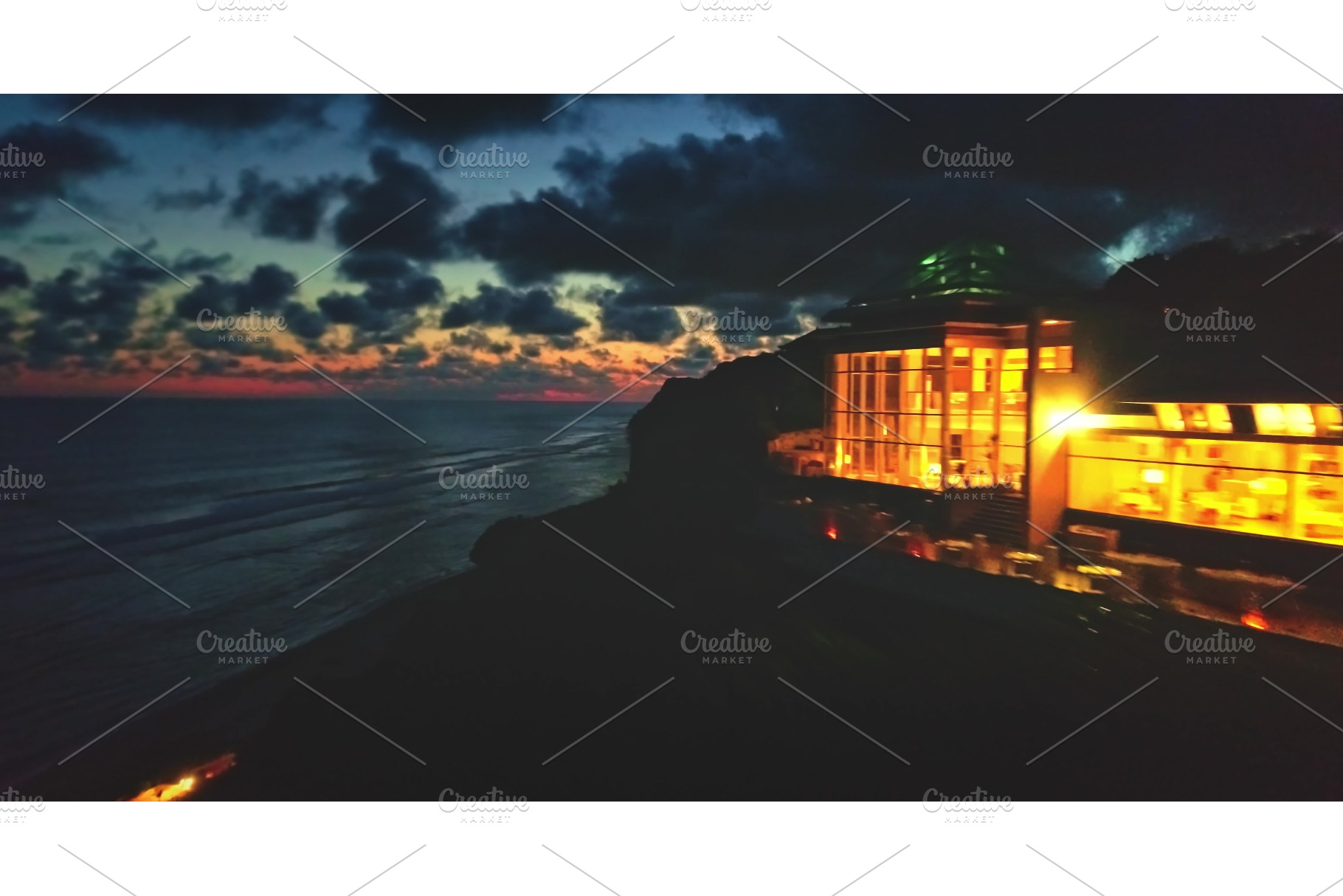 Luxurious cliffside resort glowing, a Nature Photo by Goinyk