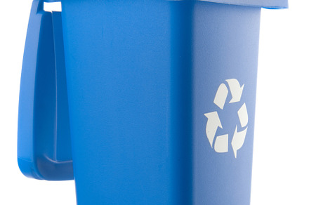 Plastic blue trash can isolated on white background