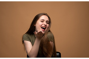 Young woman winking, smiling, and, a Person Photo by volodymyrshtun13795