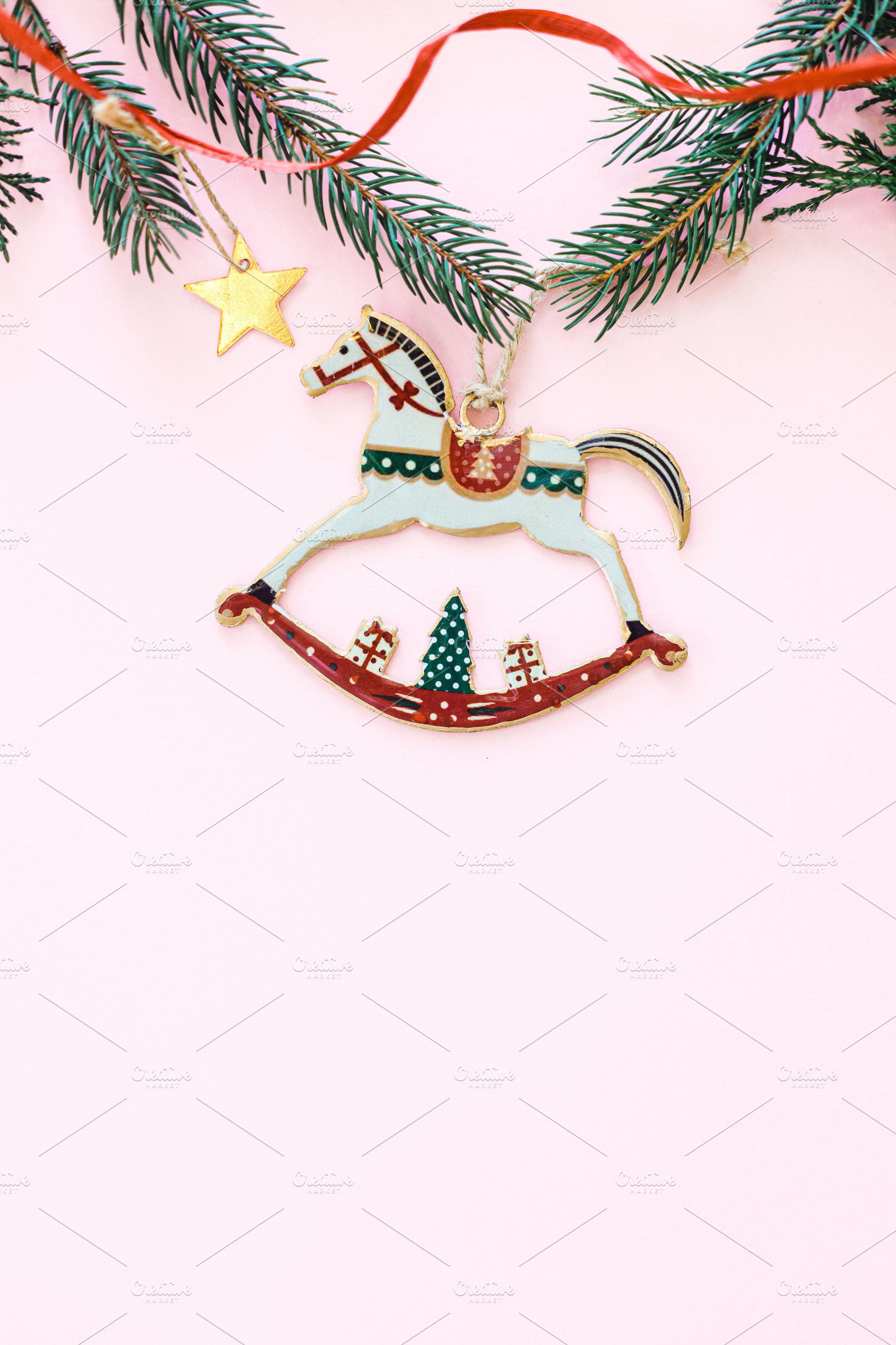 Stylish christmas horse toy flat lay on pink background with gol, a Holiday Photo by Sonjachni