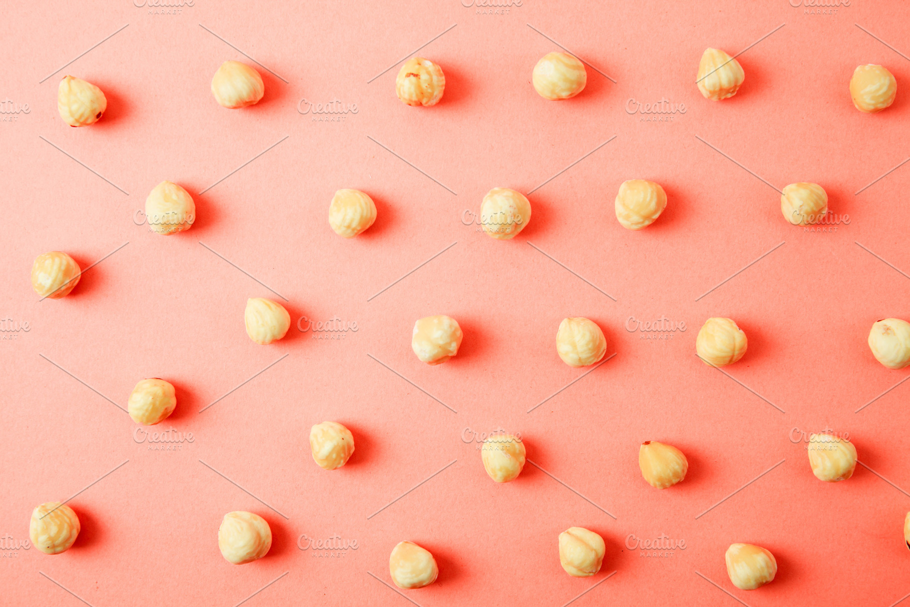 Nuts pattern - hazelnut on white bac, a Background Photo by OleksandrRybitskyi