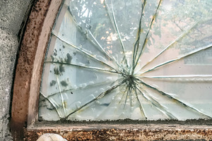 Broken glass with stone, a Wallpaper Photo by KYNA STUDIO