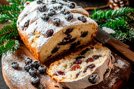 Traditional Christmas stollen fruit cake with christmas decoration background, a Food & Drink Photo by etorres69