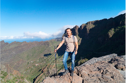 Happy middle aged man traveler while, a Sports & Recreation Photo by Neirfy
