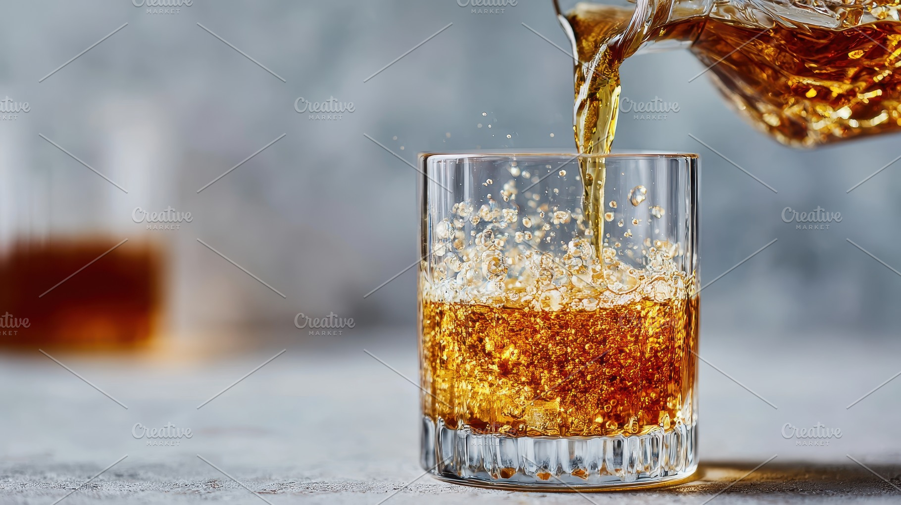 Amber liquid pours into a glass bubb, a Photo by Pixeness Studio
