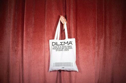 Tote Bag Mockup on Velvet Curtains, a Mockup by Dilema Studio Mockups