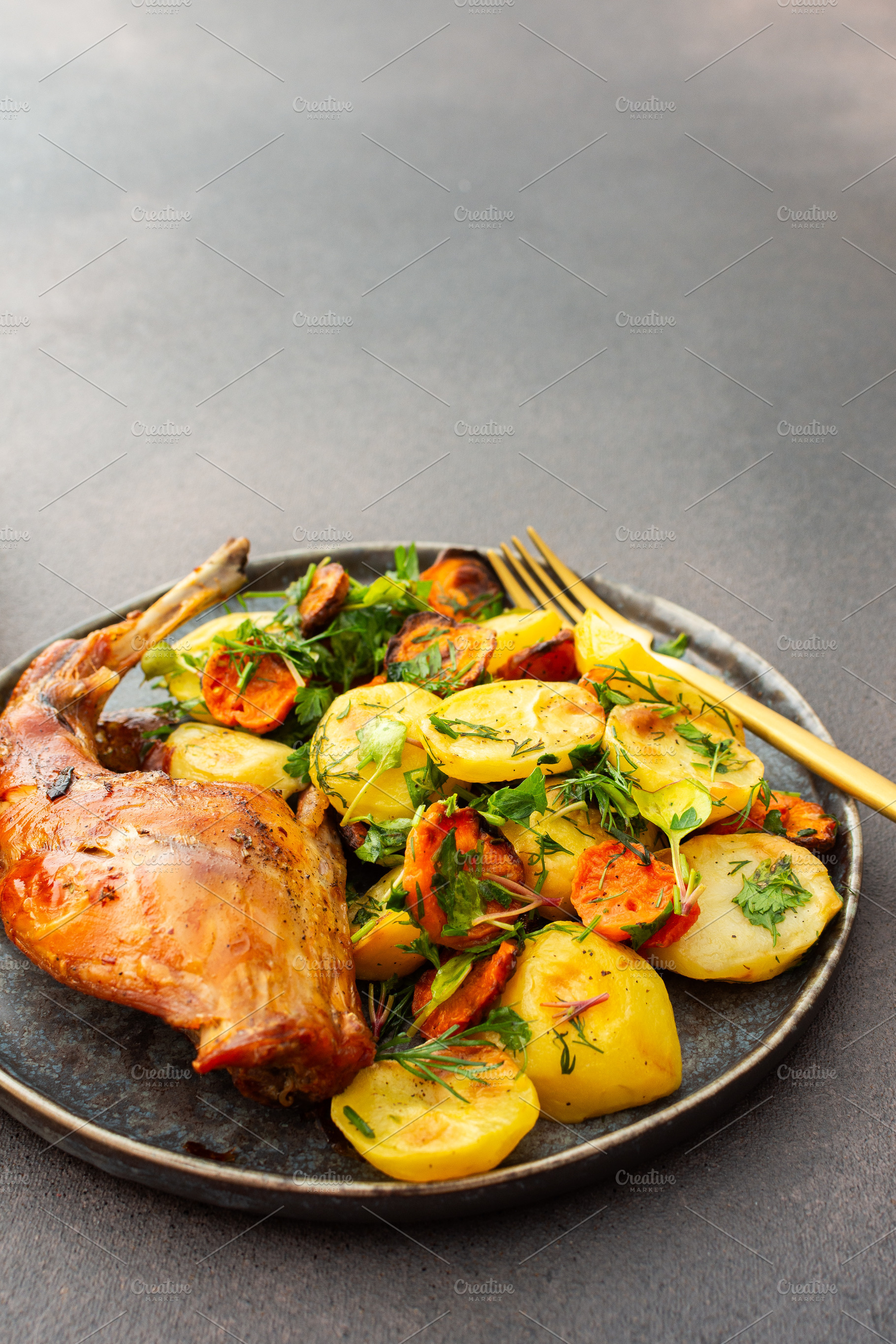 Baked rabbit with potatoes, a Food & Drink Photo by Pundateam