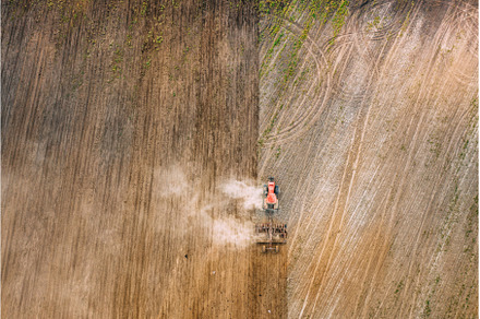 Aerial Flat View. Tractor Plowing, an Industrial Photo by Our Amazing World