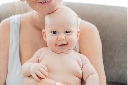 Joyful mother holding her happy