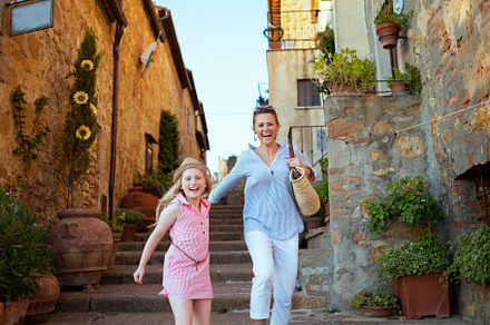 mother and child tourists in Tuscany, Italy having excursion, a Person Photo by Alliance Images