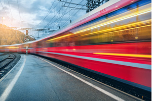 Blurred red passenger train passing, a Transportation Photo by den-belitsky