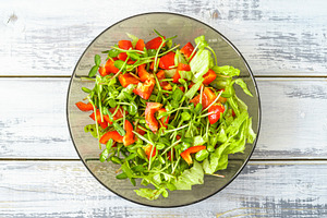 Fresh vegetable salad with micro greens and red pepper in a transparent bowl. C, a Food & Drink Photo by Eugene_Photo