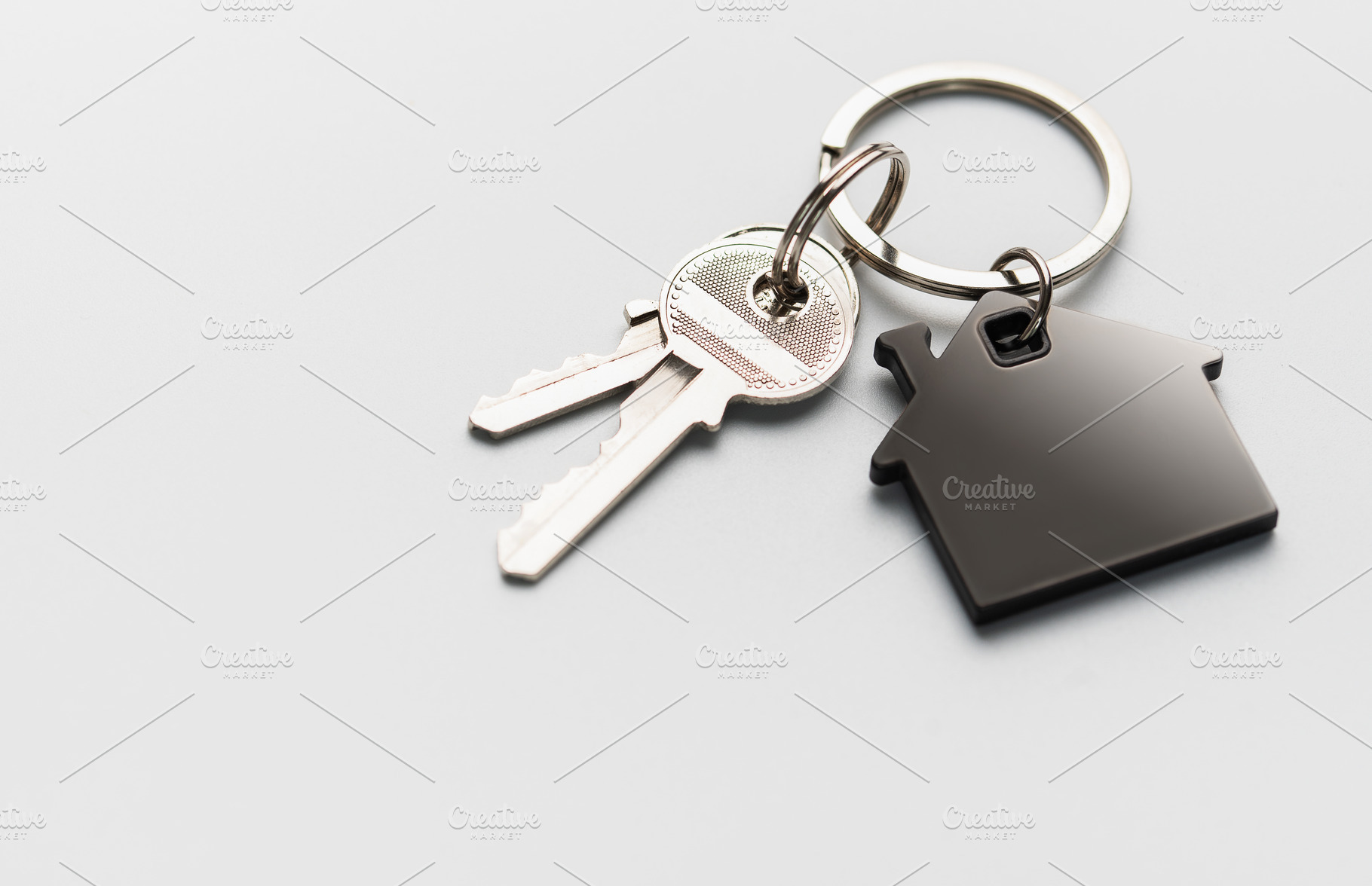 House keys with keychain representing home ownership, a Business Photo by Olena Rudo