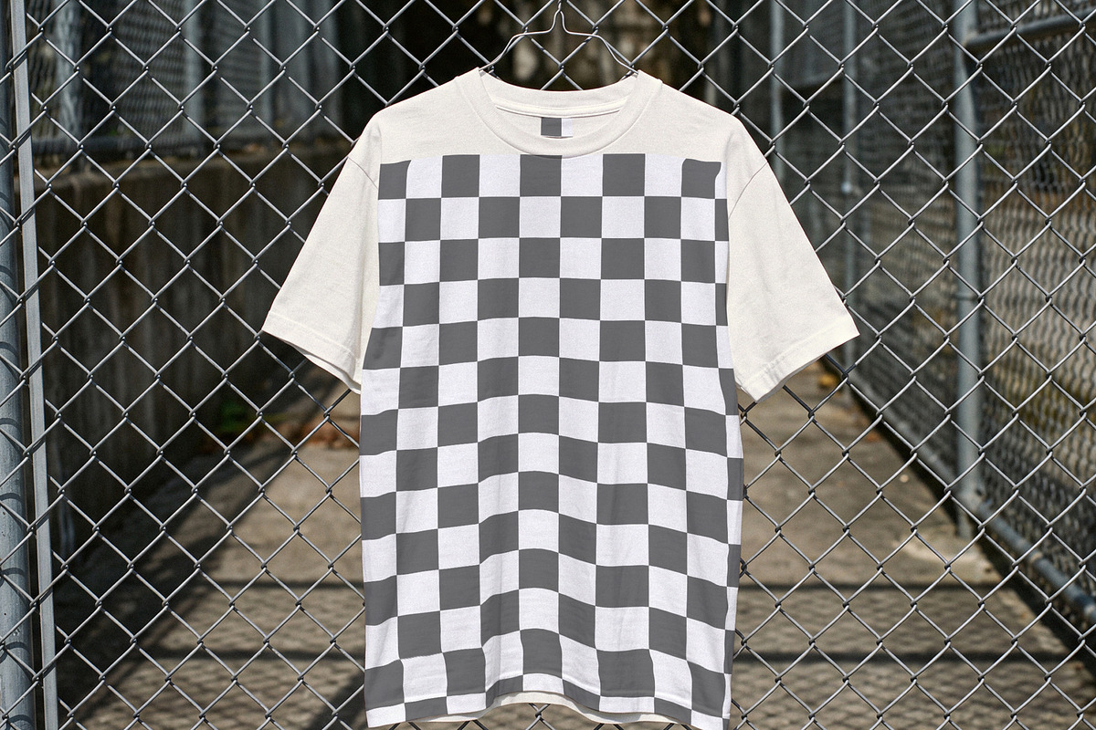 T-shirt On Chain Link Fence Mockup, a Shirt Mockup by Designer Dude (Photo 2 of 2)