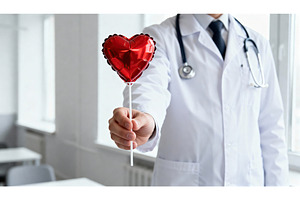 Doctor presenting a heart-shaped, a Health & Medical Photo by tilialucida